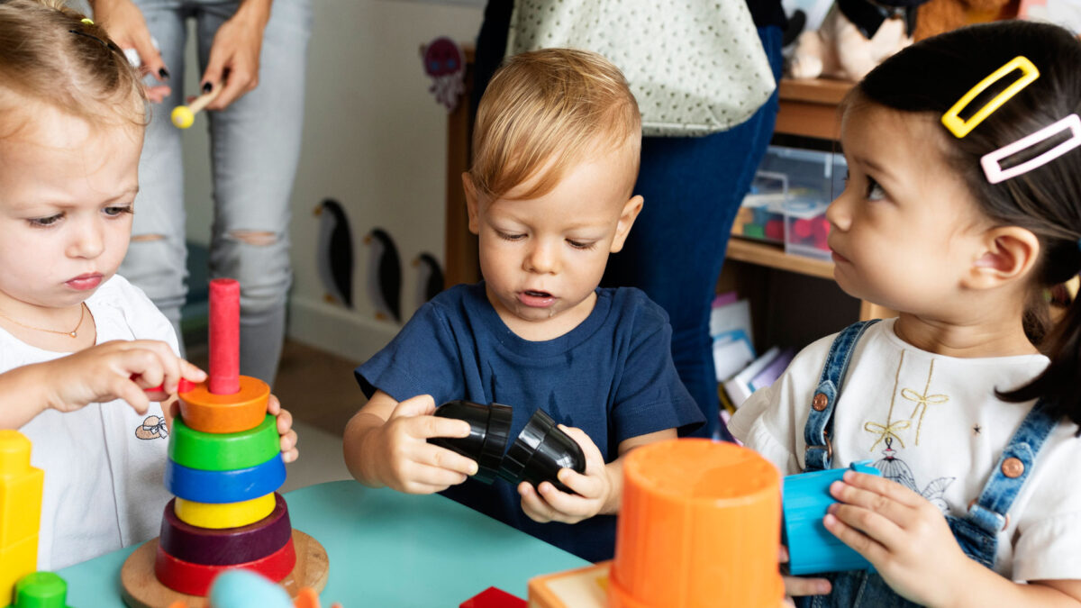 Small Children Playing With Toys